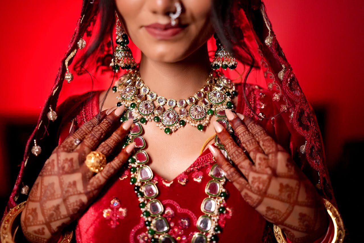 Close-up of traditional Indian bridal jewelry with intricate designs and vibrant colors.
